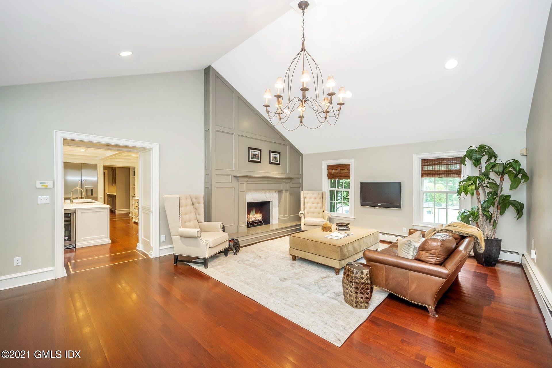 425 Stanwich Road Greenwich, CT 06830 - Photo 9 of 36 a living room with furniture or chandelier and a wooden floor