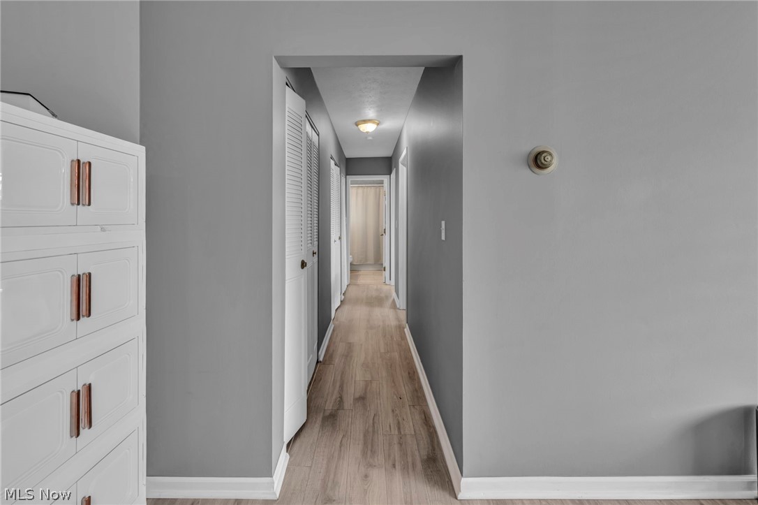 5200 Royalton Road, Unit 9B North Royalton, OH 44133 - Photo 15 of 27 Hallway with baseboards and light wood finished floors