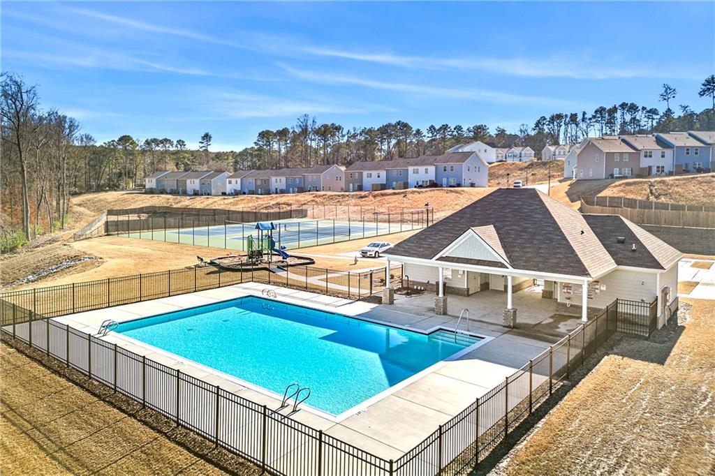 7492 Knoll Hollow Road Lithonia, GA 30058 - Photo 29 of 30 a view of a swimming pool with an outdoor seating