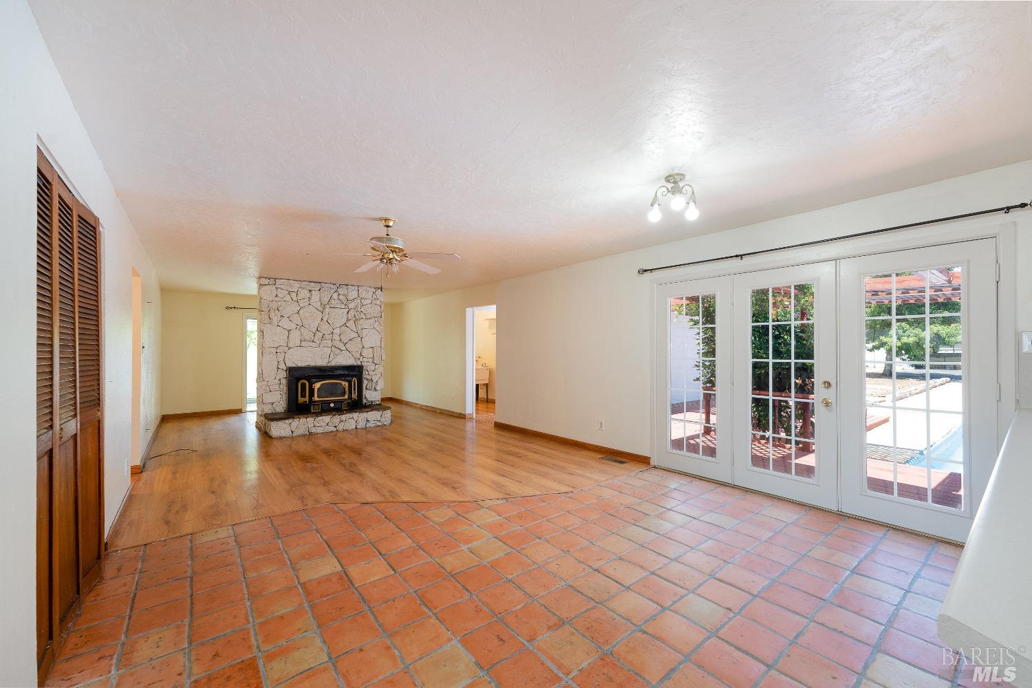 220 Gobalet Lane Ukiah, CA 95482 - Photo 1 of 1 a view of an empty room with a fireplace and a window