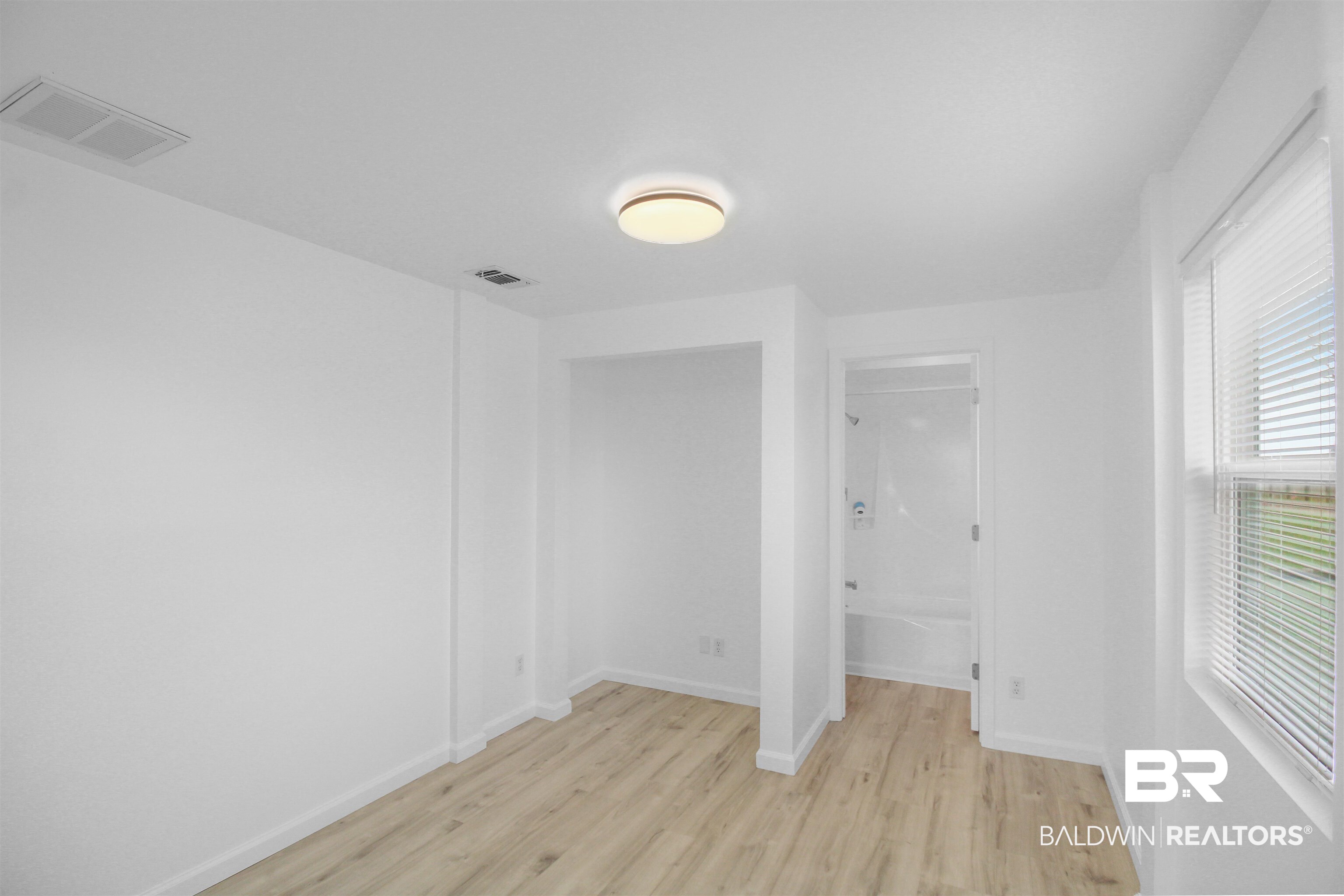 17622 Brewer Road Foley, AL 36535 - Photo 5 of 26 Unfurnished bedroom with light wood finished floors and baseboards