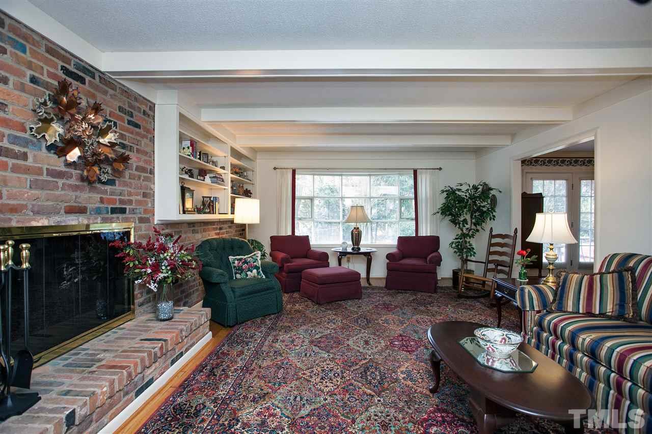 730 Hardimont Road Raleigh, NC 27609 - Photo 2 of 19 a living room with furniture and a fireplace