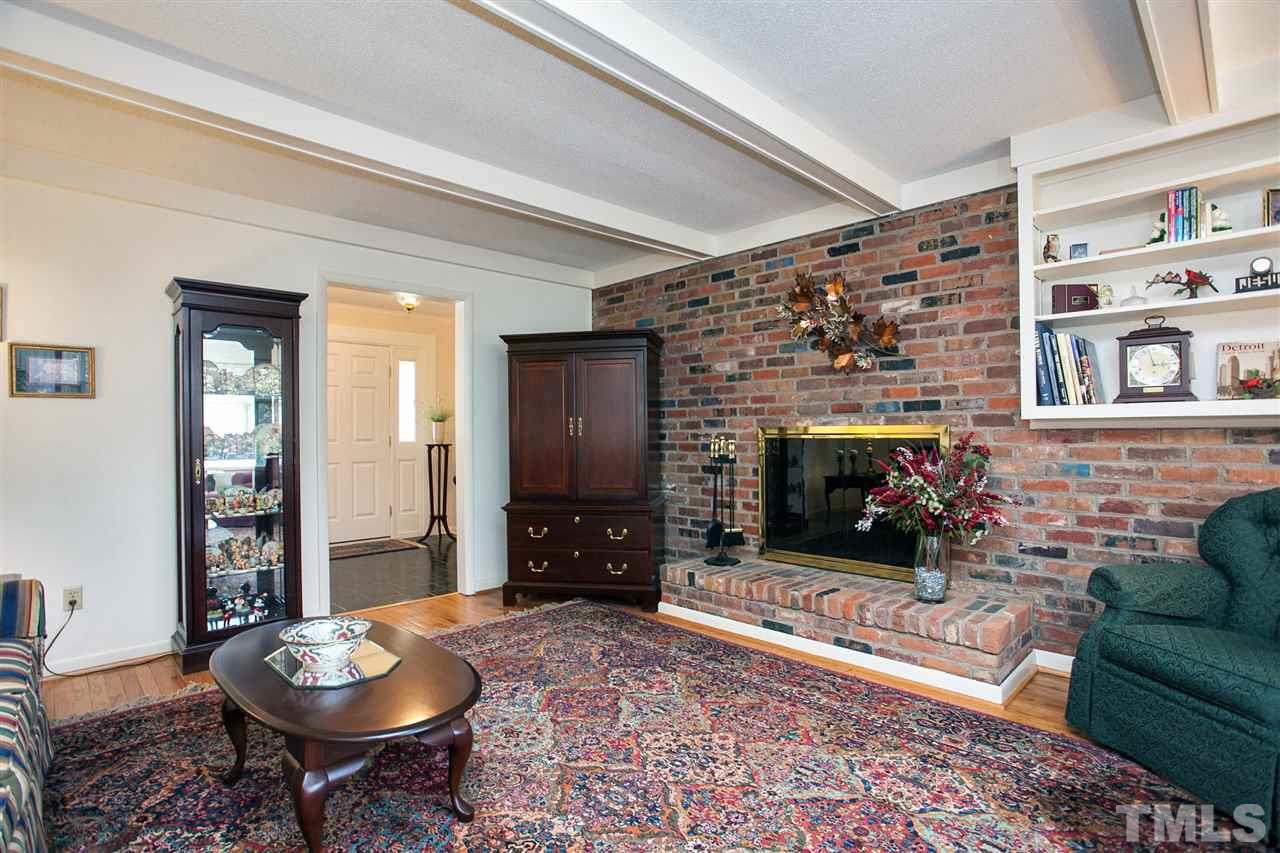 730 Hardimont Road Raleigh, NC 27609 - Photo 3 of 19 a living room with furniture and a fireplace