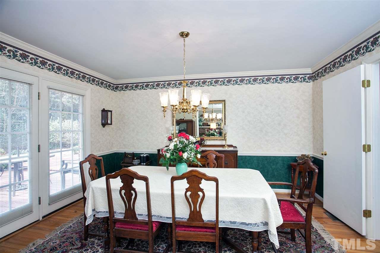 730 Hardimont Road Raleigh, NC 27609 - Photo 4 of 19 a view of a dining room with furniture window and wooden floor