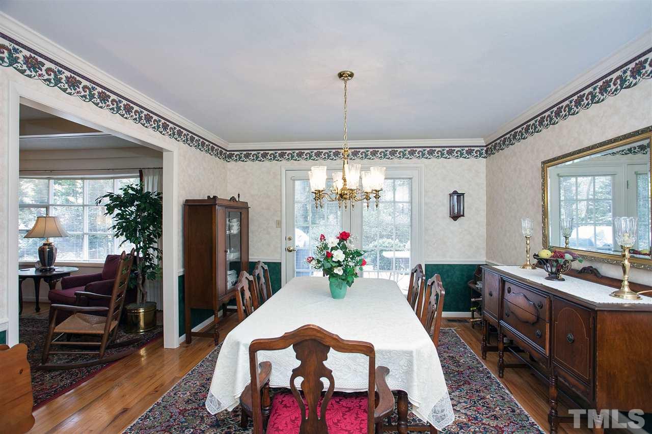 730 Hardimont Road Raleigh, NC 27609 - Photo 5 of 19 a view of a dining room with furniture window and wooden floor