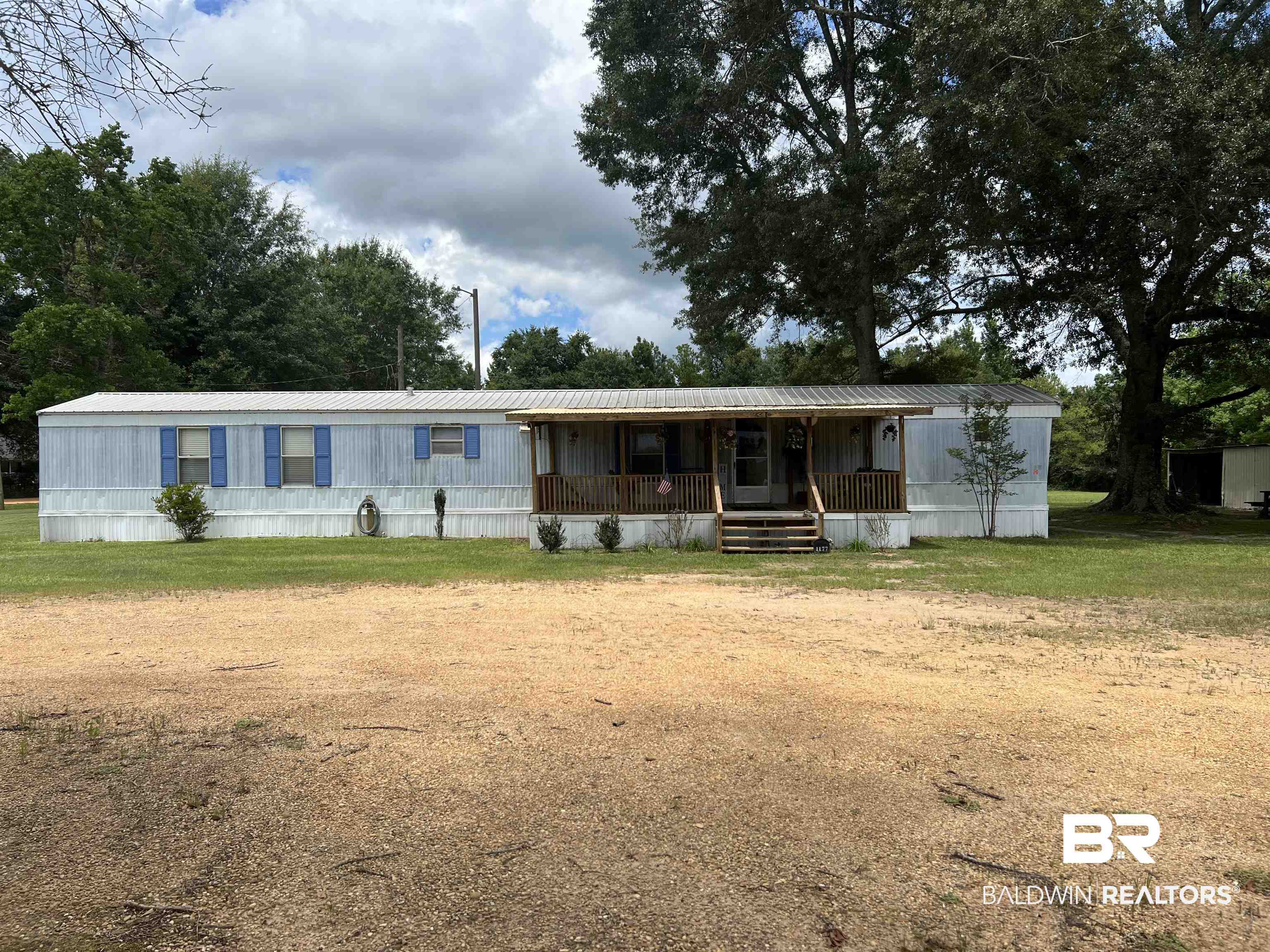 1177 McMillan Road Monroeville, AL 36460 - Photo 1 of 21 Manufactured / mobile home featuring a porch and a front yard