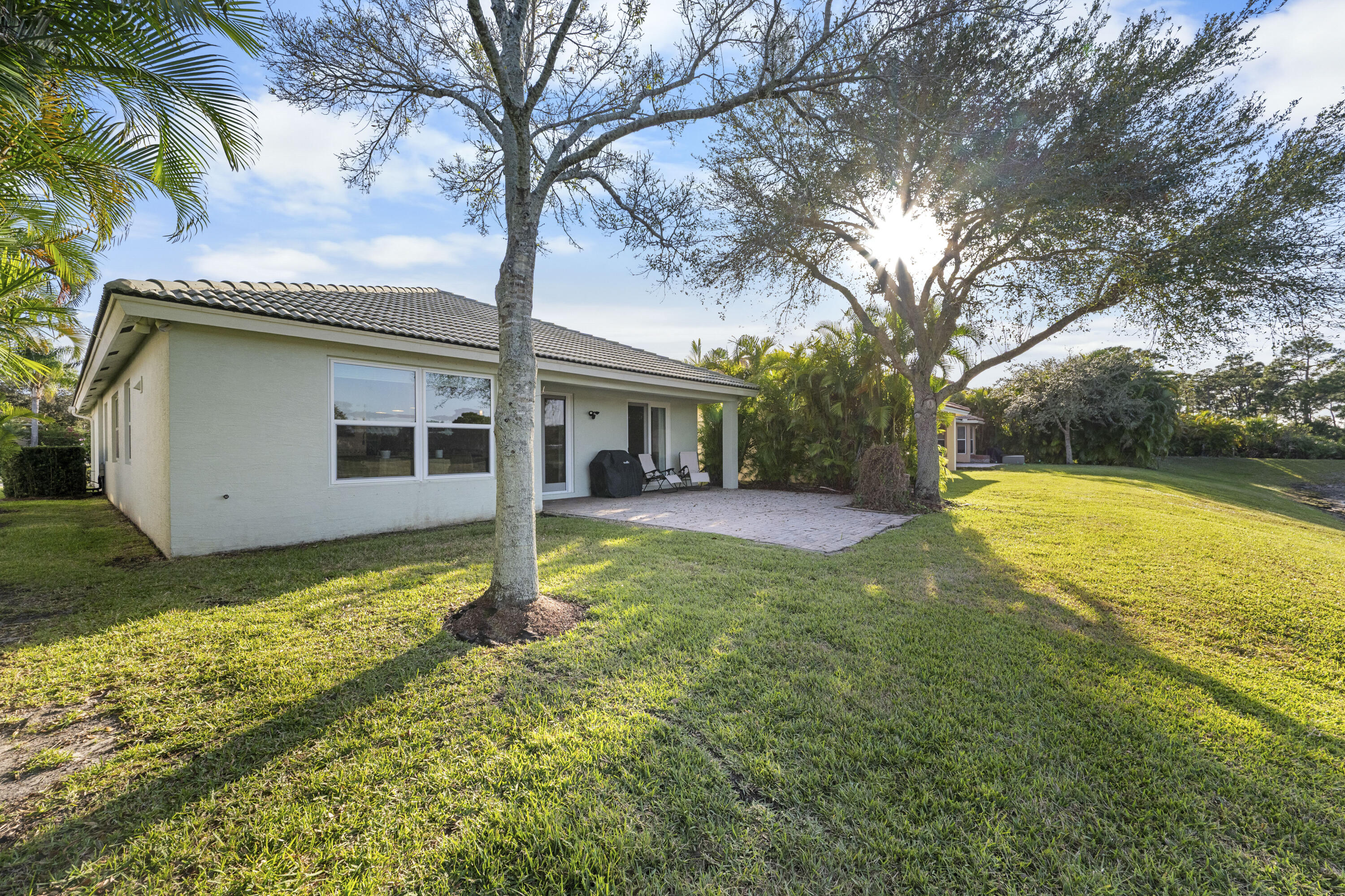 Undisclosed Address Stuart, FL 34997 - Photo 5 of 13 a view of a house with backyard and tree s