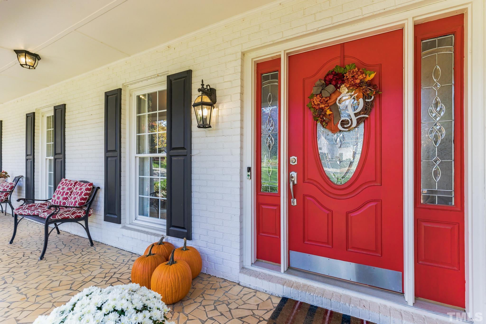 6813 Foxfire Place Raleigh, NC 27615 - Photo 2 of 34 a bedroom with furniture and a window
