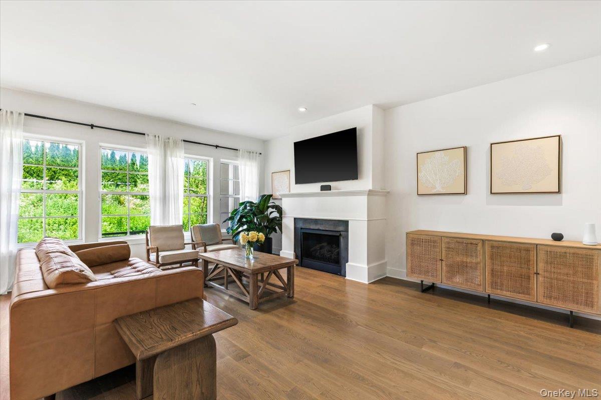 3 Jasmine Lane Rye Brook, NY 10573 - Photo 4 of 31 High ceilings, wood floors throughout, family room with fireplace