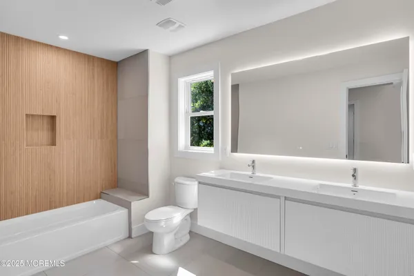 a bathroom with a sink toilet and bathtub