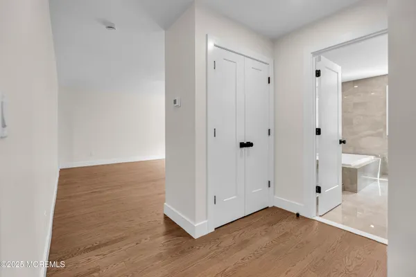 a view of a bathroom with wooden floor
