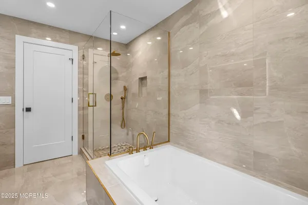 a bathroom with a shower and a shower