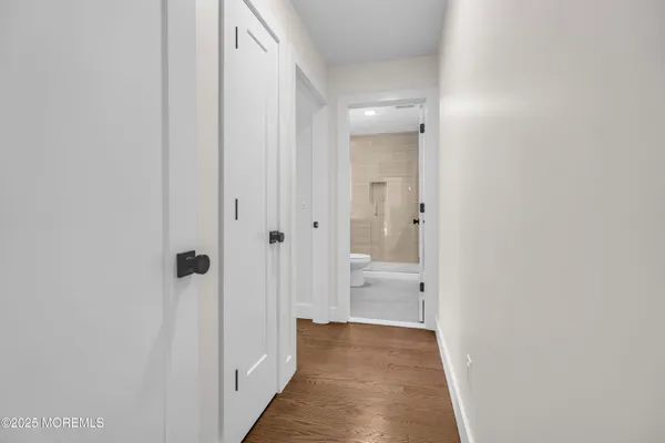 a view of a bathroom from a hallway