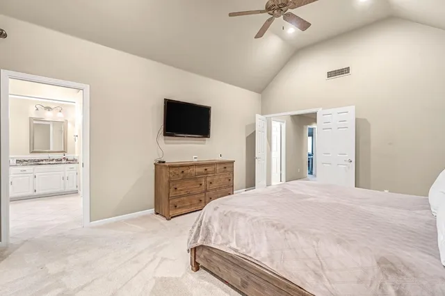 a spacious bathroom with a tub sink shower and mirror