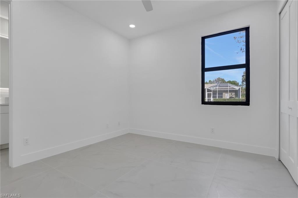 730 29th Street Southwest Naples, FL 34117 - Photo 28 of 50 Empty room featuring recessed lighting and a ceiling fan