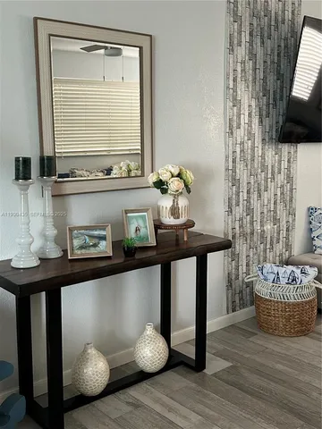 a kitchen with stainless steel appliances a sink dishwasher stove refrigerator and cabinets