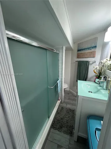 a bathroom with a sink and toilet
