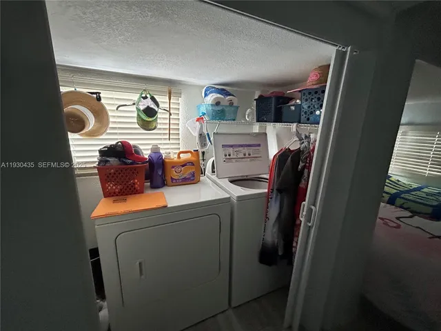 a bedroom with bed and a couch