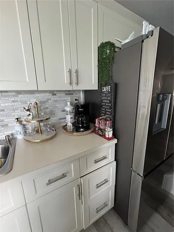 a view of a living room and floor to ceiling window