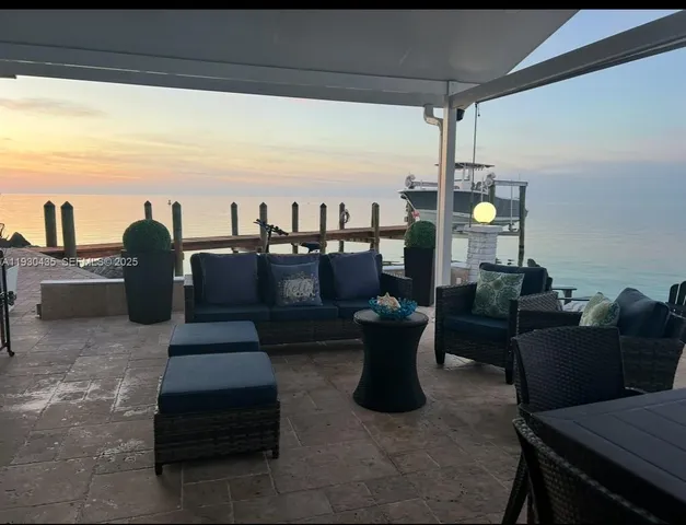 a living room with furniture wooden floor and a window