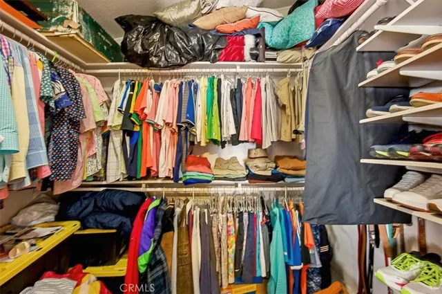 a bed room with a bed and a chandelier