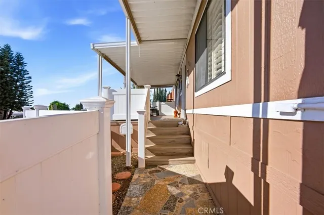 a view of a patio with a table and chairs