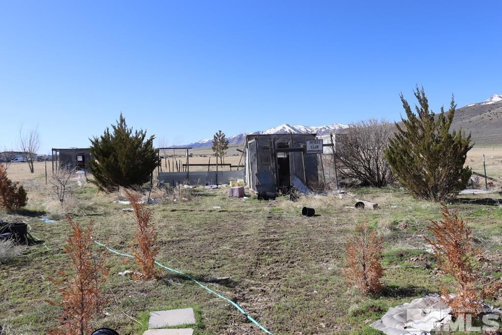 270 McNeil Road Winnemucca, NV 89445 - Photo 16 of 21 a view of a garden with a building in the background
