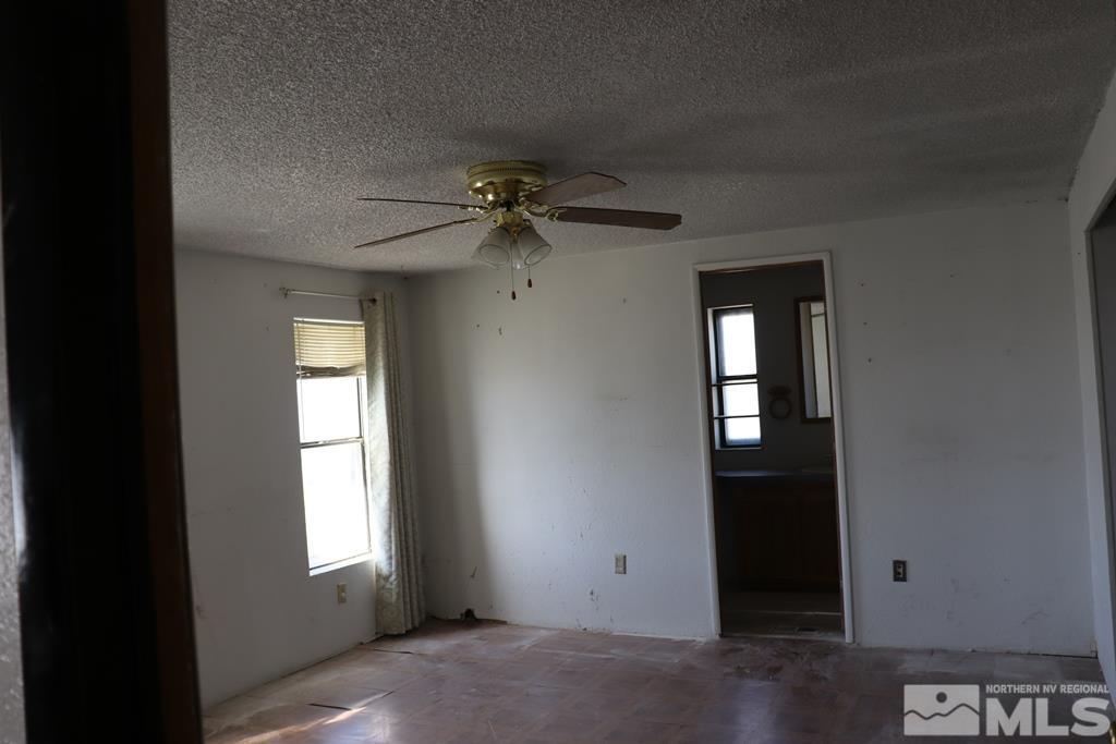 270 McNeil Road Winnemucca, NV 89445 - Photo 4 of 21 an empty room that has a window