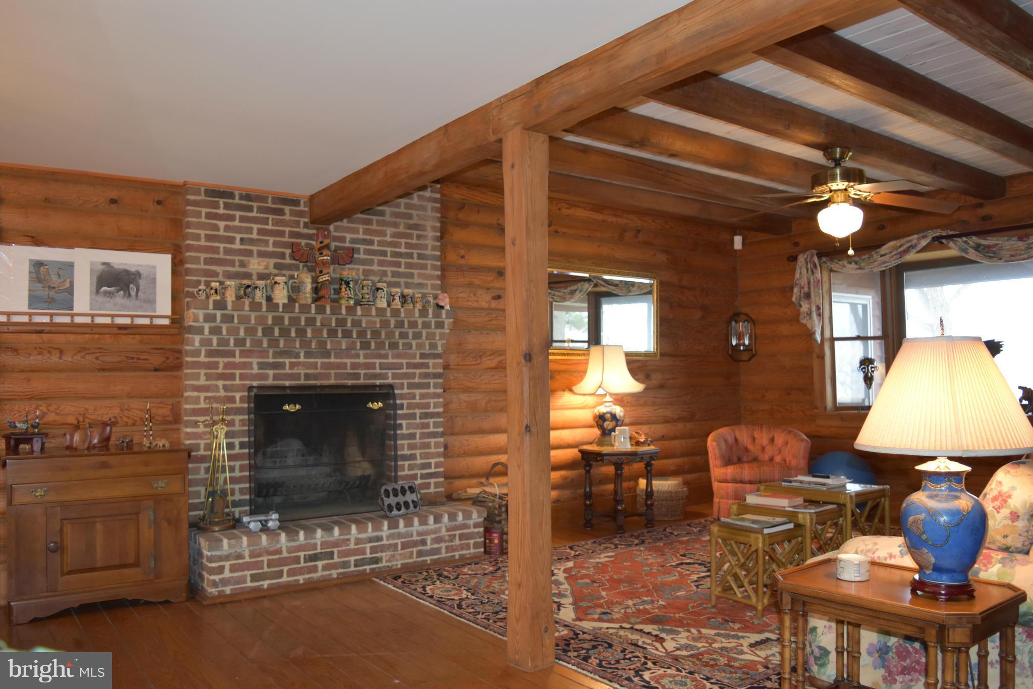 5176 Black Walnut Point Road Tilghman, MD 21671 - Photo 13 of 30 Great Room wood burning fireplace