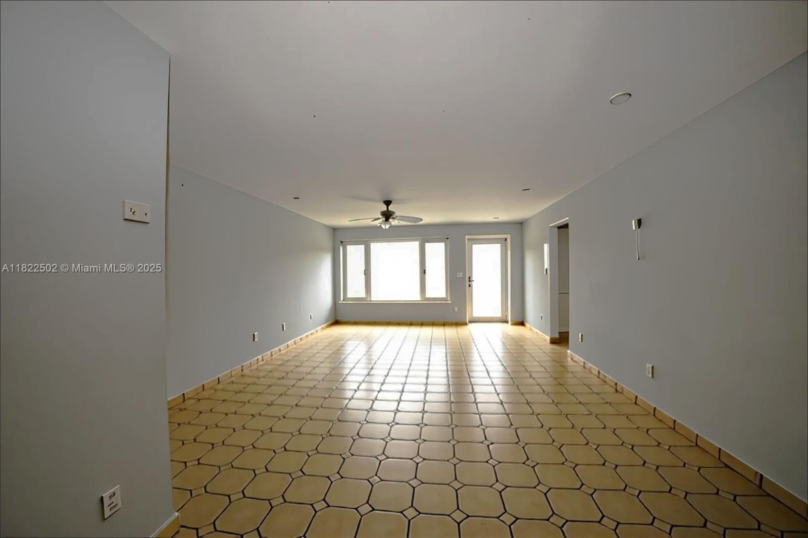 22115 Southwest 58th Avenue Boca Raton, FL 33428 - Photo 12 of 18 a view of an empty room and window