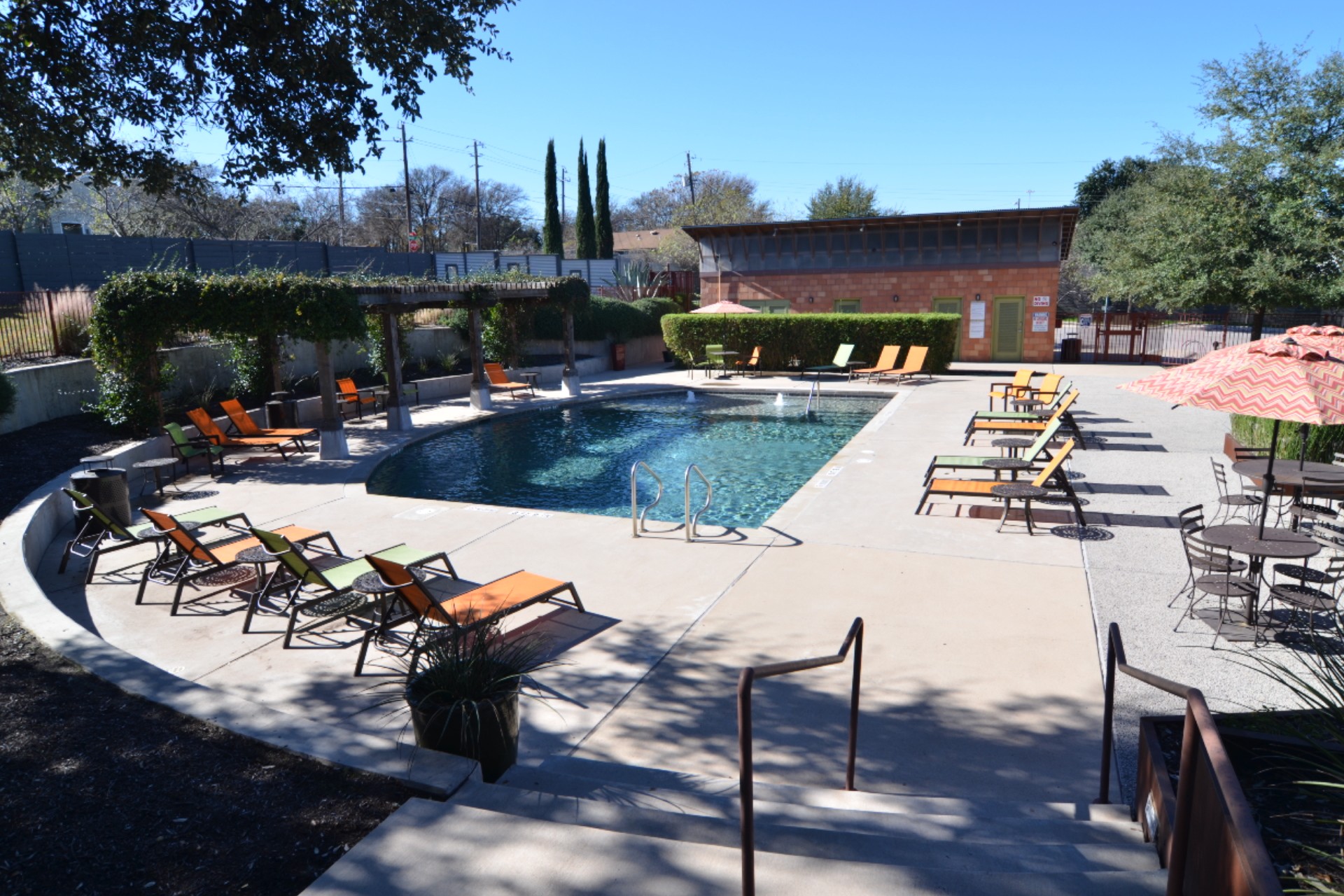 1916 Cleese Drive Austin, TX 78741 - Photo 35 of 36 An inviting pool area offers relaxation and enjoyment under a vibrant sky.