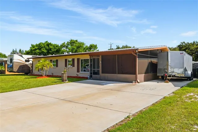 a living room with furniture and flowers