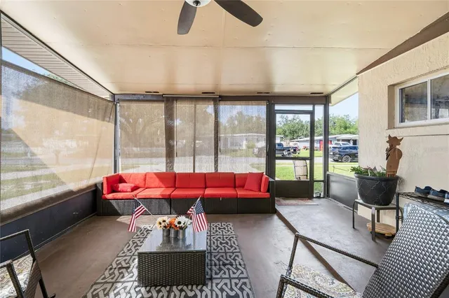 a view of a livingroom with chair and front door