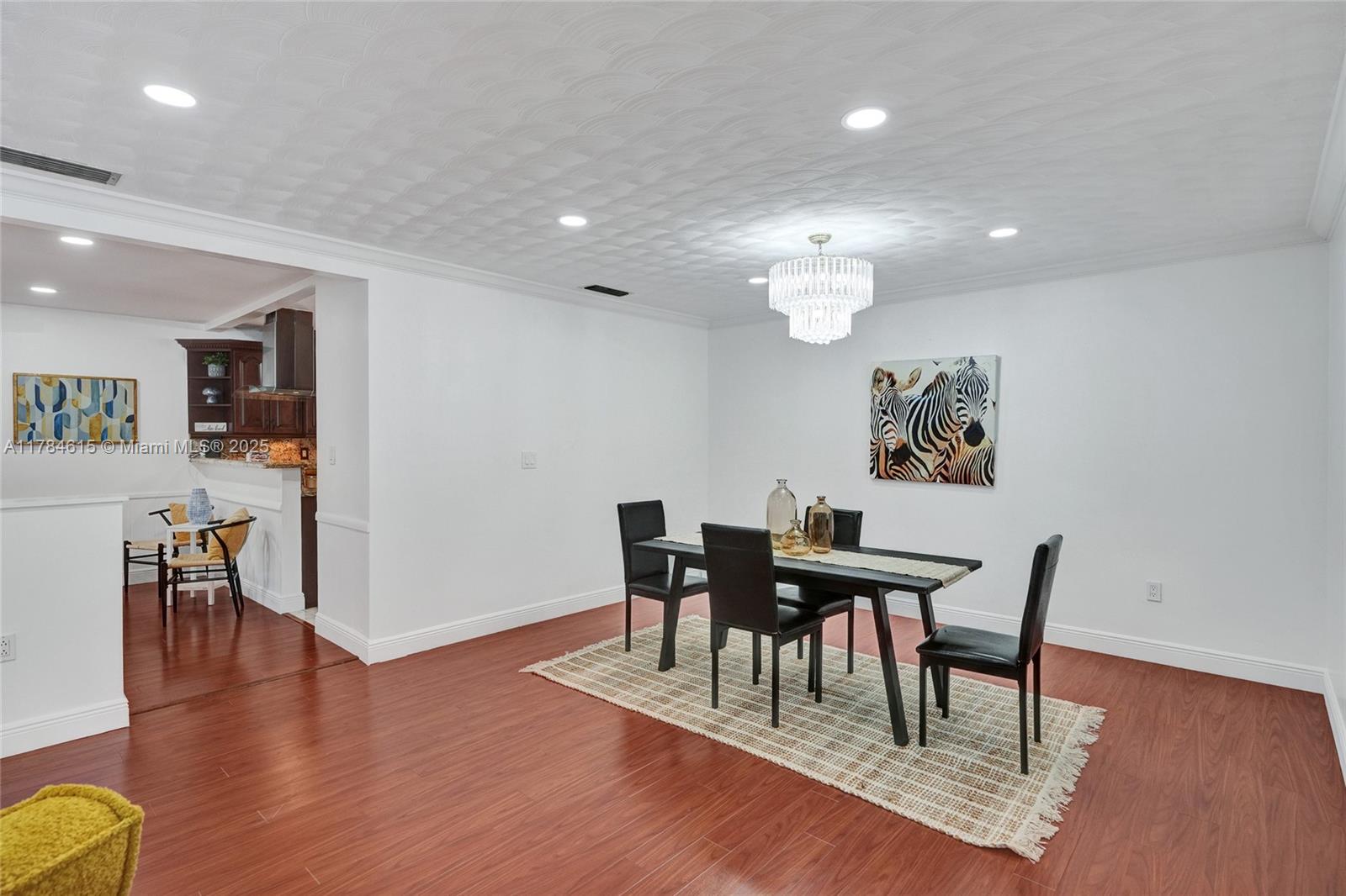 7360 Southwest 120th Street Pinecrest, FL 33156 - Photo 18 of 68 a view of a dining room with furniture and wooden floor