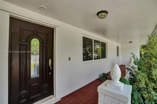 a room with pool and windows