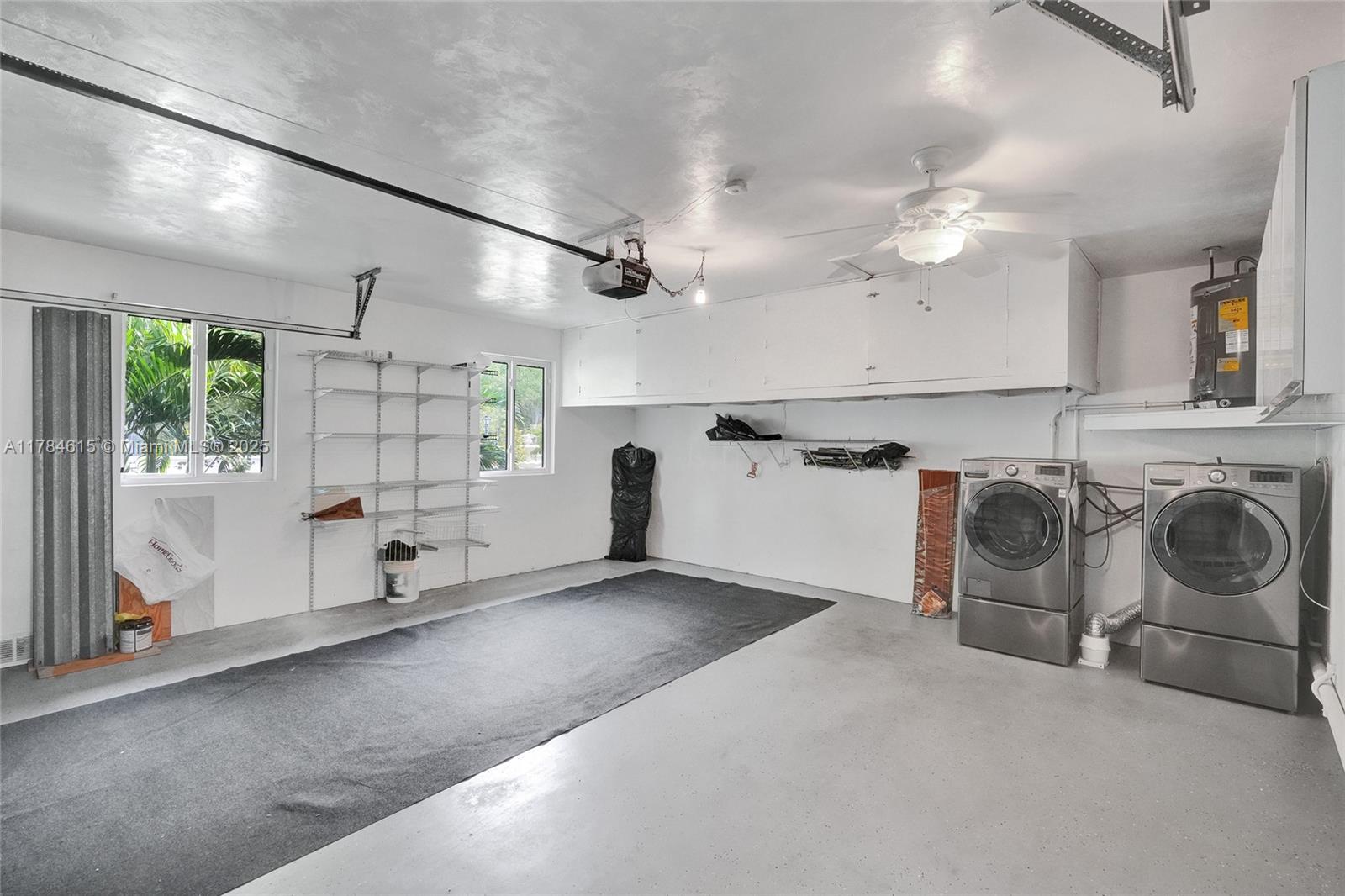 7360 Southwest 120th Street Pinecrest, FL 33156 - Photo 42 of 68 a view of a storage & utility room with washer and dryer