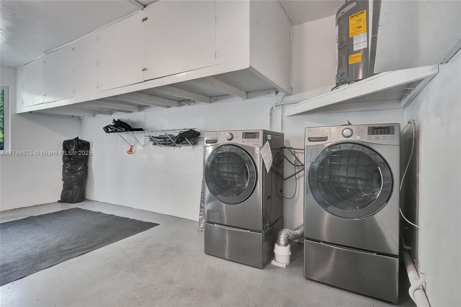 7360 Southwest 120th Street Pinecrest, FL 33156 - Photo 43 of 68 a utility room with dryer and washer
