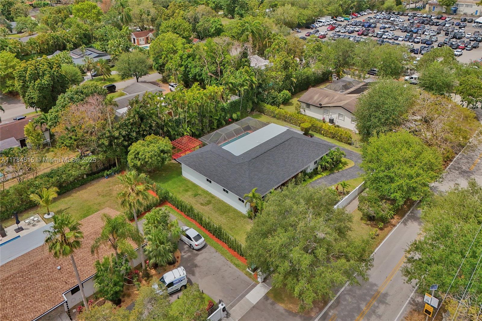7360 Southwest 120th Street Pinecrest, FL 33156 - Photo 53 of 68 an aerial view of a house with a garden