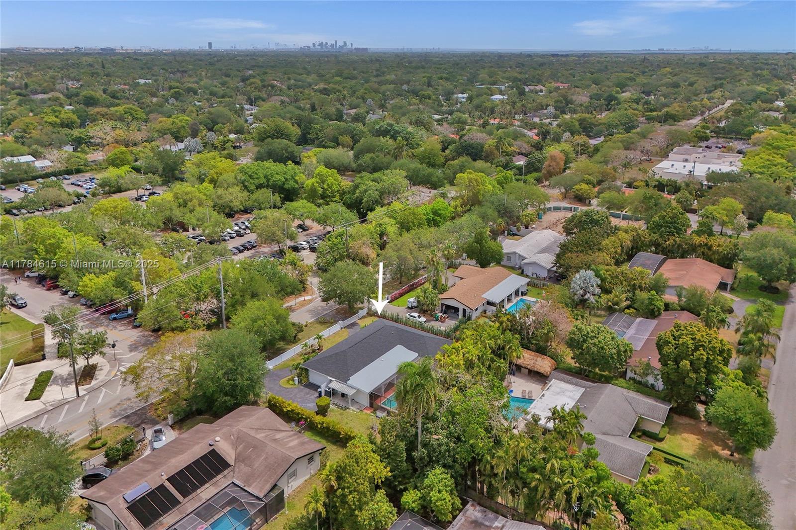 7360 Southwest 120th Street Pinecrest, FL 33156 - Photo 58 of 68 an aerial view of residential houses with outdoor space and trees
