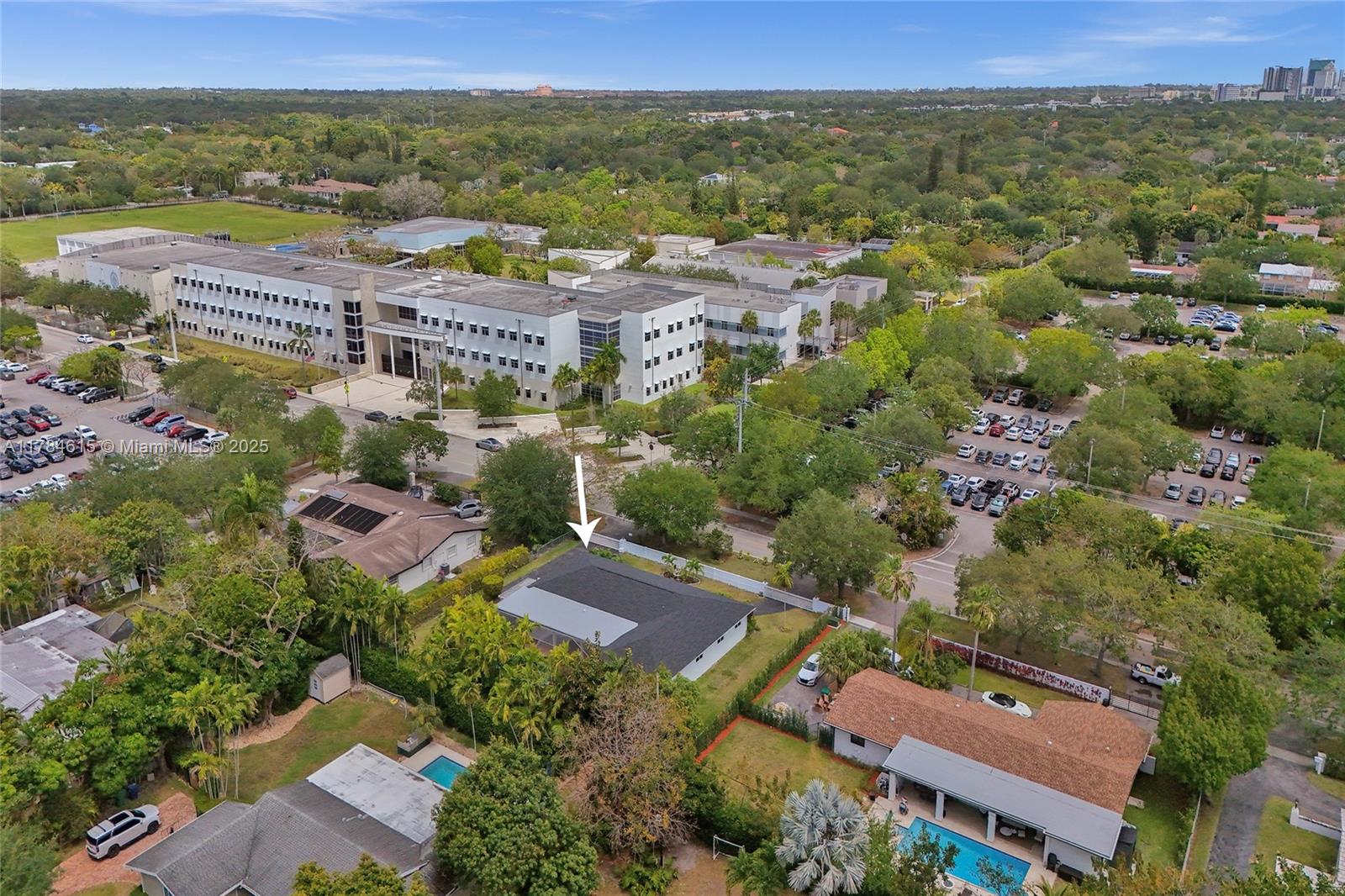 7360 Southwest 120th Street Pinecrest, FL 33156 - Photo 60 of 68 an aerial view of a city with lots of residential buildings