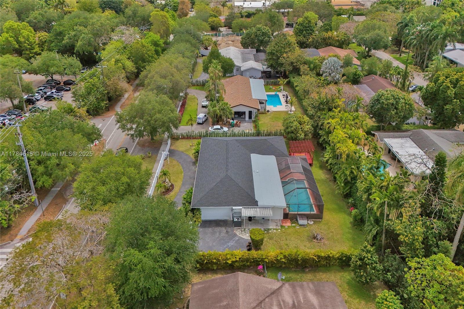 7360 Southwest 120th Street Pinecrest, FL 33156 - Photo 64 of 68 an aerial view of residential houses with outdoor space and street view