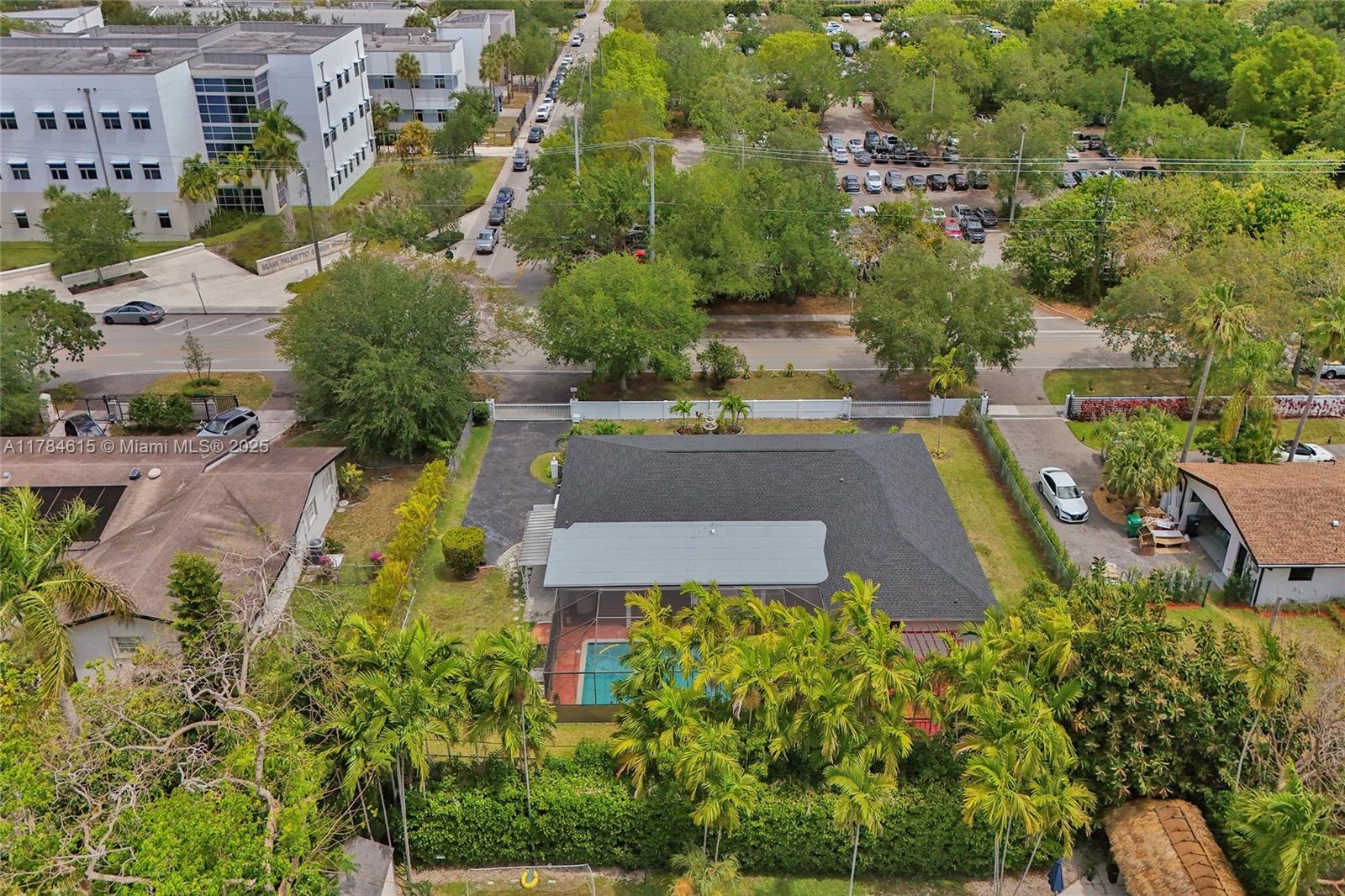 7360 Southwest 120th Street Pinecrest, FL 33156 - Photo 66 of 68 an aerial view of residential houses with outdoor space and street view
