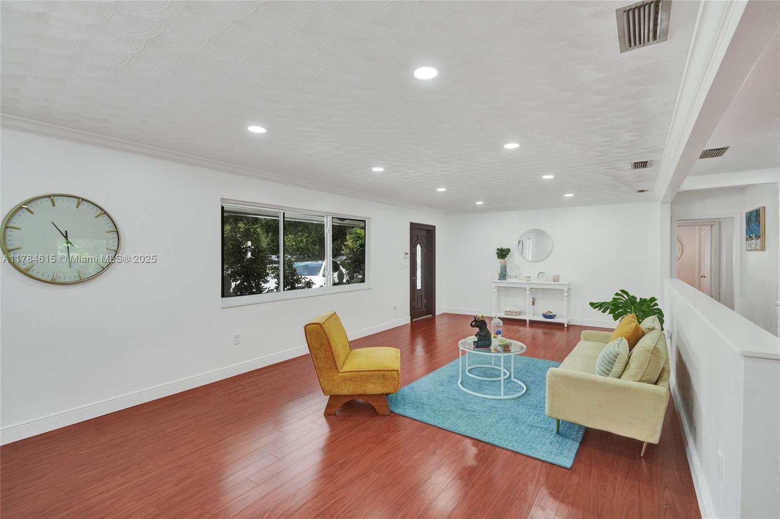 7360 Southwest 120th Street Pinecrest, FL 33156 - Photo 7 of 68 a living room with furniture and a large window