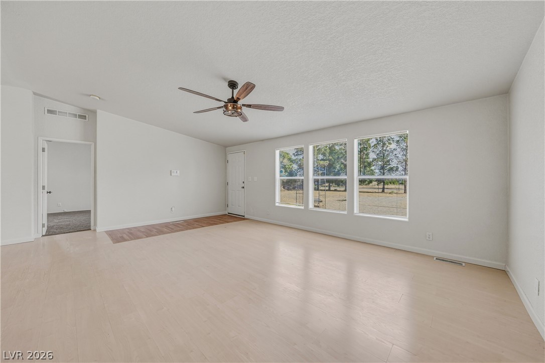 1890 West Dyer Road Pahrump, NV 89048 - Photo 40 of 40 This airy living area features abundant natural light and seamless access to outdoor serenity.