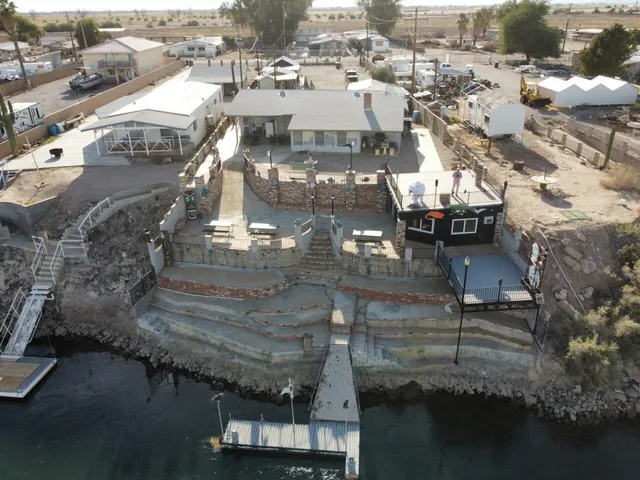 an aerial view of a house with balcony and deck
