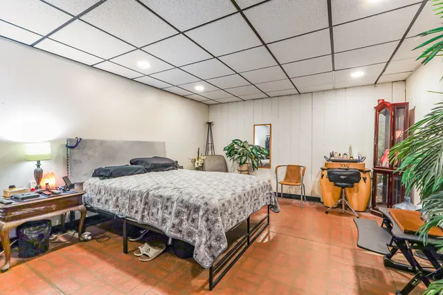 a bedroom with a bed and a table in it