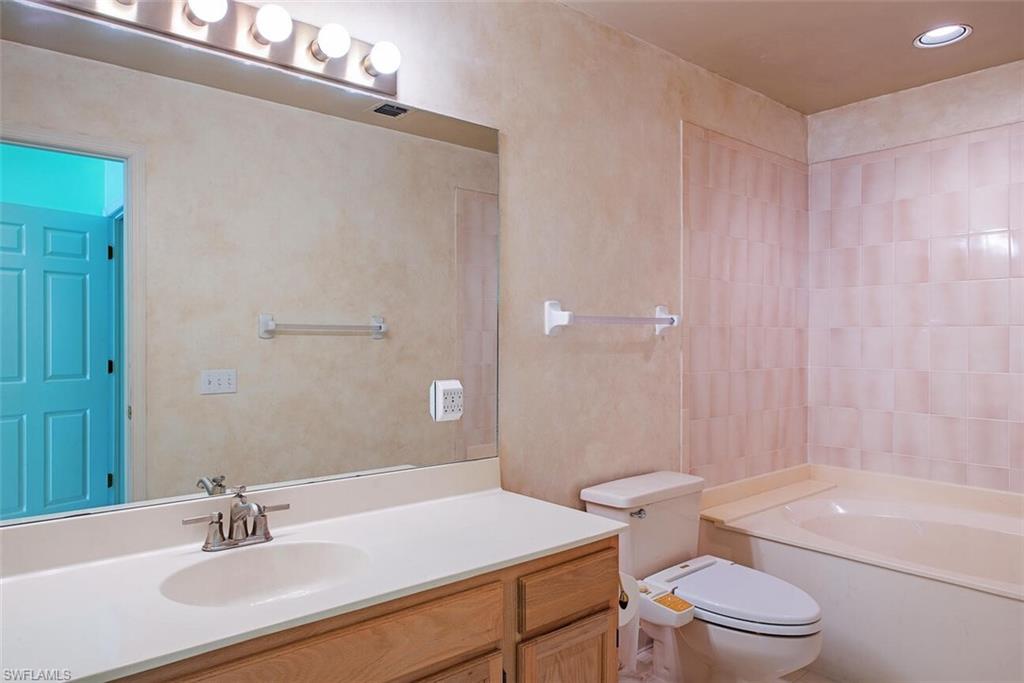 808 Rue Deville, Unit 35 Naples, FL 34108 - Photo 11 of 20 Full bath featuring vanity, recessed lighting, and bathing tub / shower combination