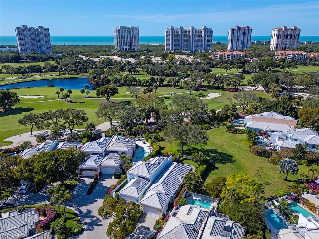 808 Rue Deville, Unit 35 Naples, FL 34108 - Photo 18 of 20 View of urban area with a large body of water and a local golf course