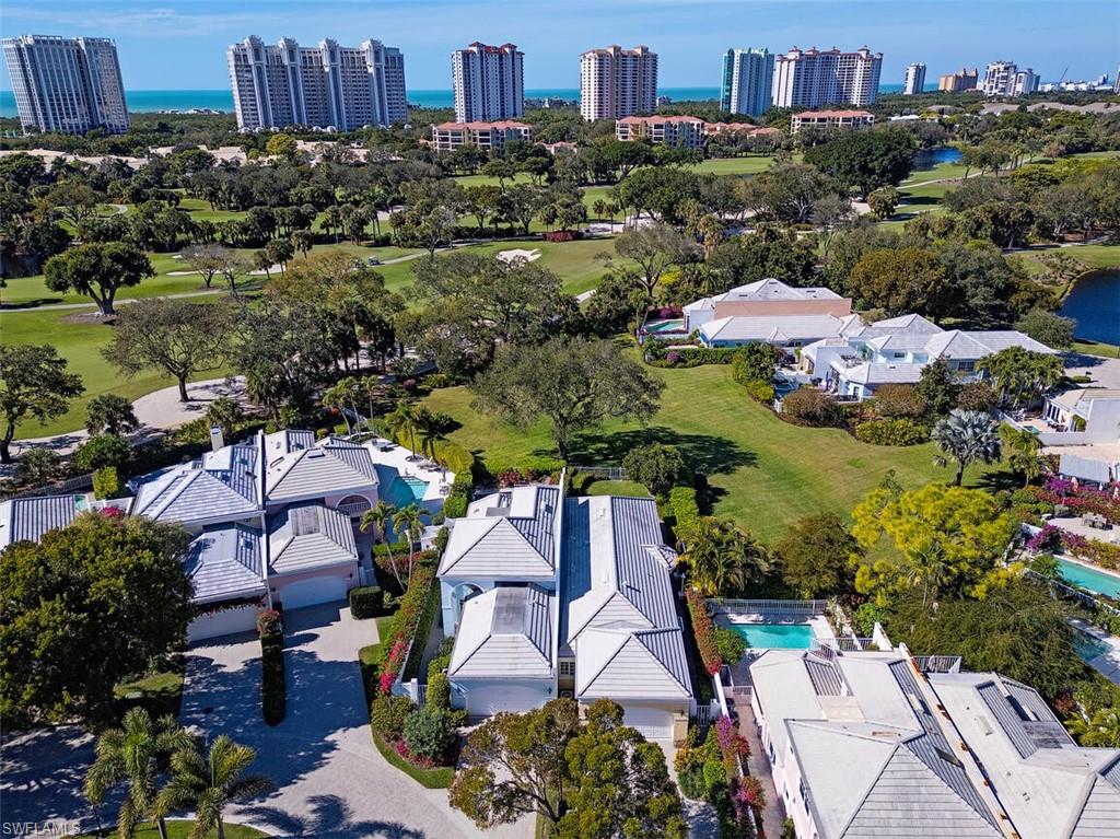 808 Rue Deville, Unit 35 Naples, FL 34108 - Photo 19 of 20 View of urban area with a nearby body of water and a local golf course
