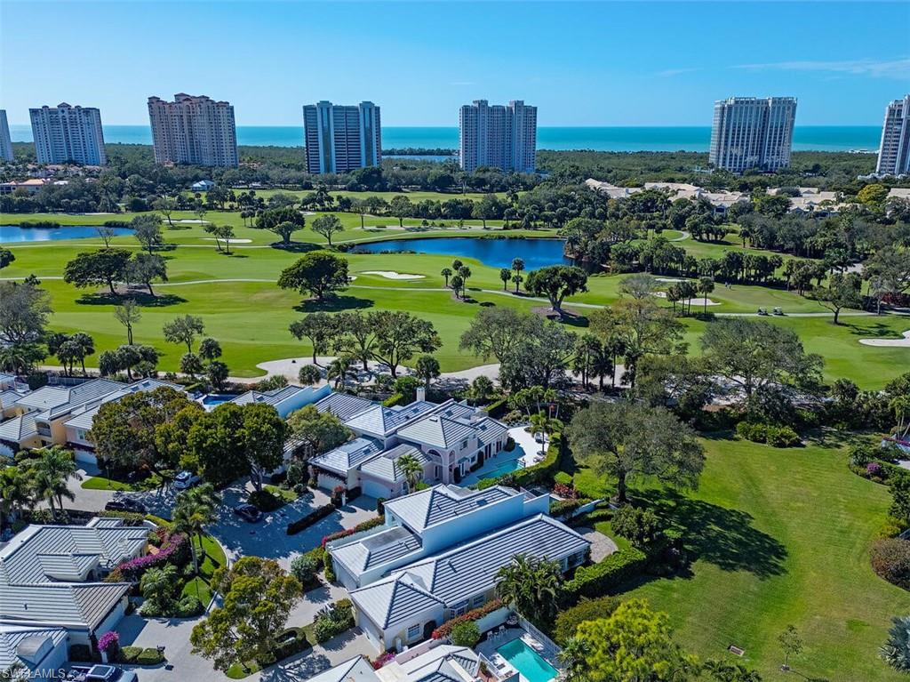 808 Rue Deville, Unit 35 Naples, FL 34108 - Photo 20 of 20 Bird's eye view of a large body of water and a golf club